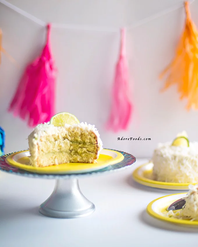 Delicious and easy Pina Colada cake recipe for Cinco de Mayo. Moist coconut sponge, lime curd and pineapple buttercream and shredded coconut flakes. #pinacoladacake #cincodemayorecipe