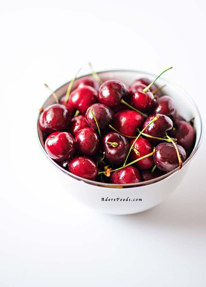 a bowl full of fresh cherries