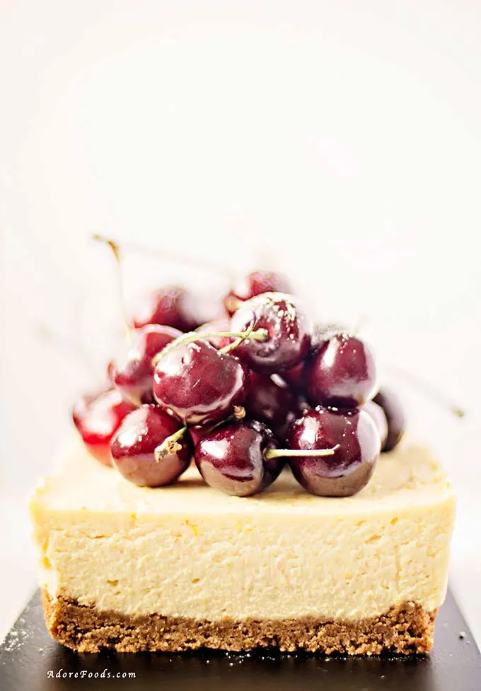 close up no bake cherry cheesecake with fresh cherries on top