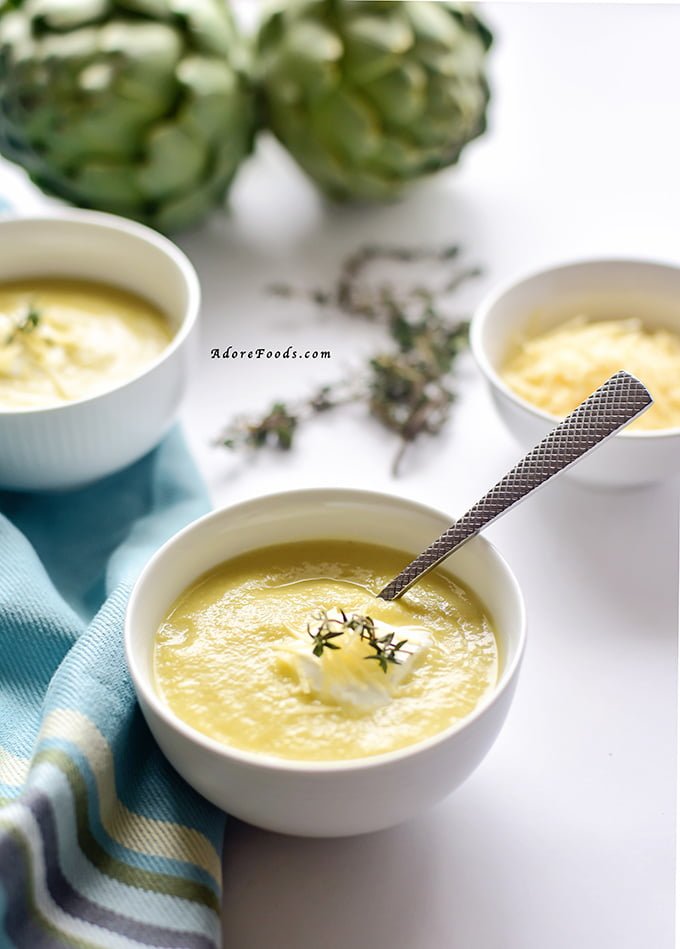 Perfect spring recipe! Creamy artichoke soup served with parmesan, sour cream and fresh thyme! In less than 30 minutes, you''ll ladle this soup into your bowls!