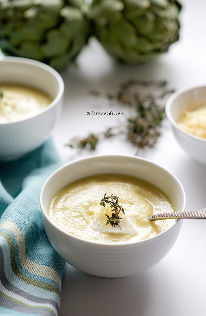 Creamy artichoke soup with parmesan and sour cream