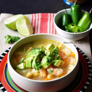Mexican Seafood Soup - tender shrimp pieces, carrots and beans in a spicy smoky adobo broth. This authentic Mexican soup is on the table in 30 minutes. #mexican