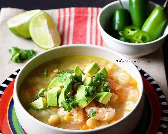 Mexican Seafood Soup - tender shrimp pieces, carrots and beans in a spicy smoky adobo broth. This authentic Mexican soup is on the table in 30 minutes. #mexican