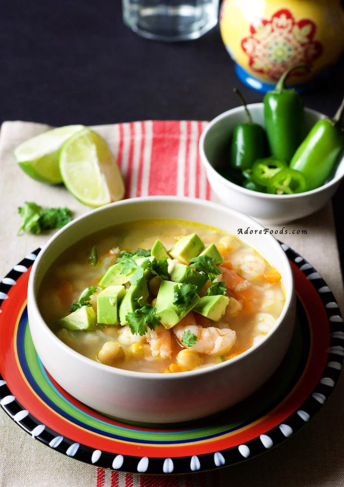 Mexican Seafood Soup - tender shrimp pieces, carrots and beans in a spicy smoky adobo broth. This authentic Mexican soup is on the table in 30 minutes. #mexican