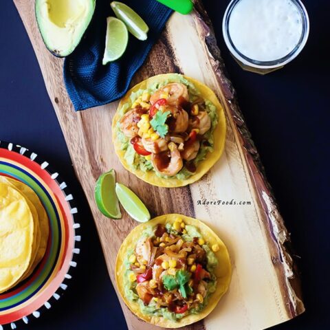 Spicy Chipotle Shrimp & Corn Tostadas - crunchy corn tortillas, creamy adobo guacamole and juicy shrimp and corn topping. One of the best tostadas I have ever eaten.
