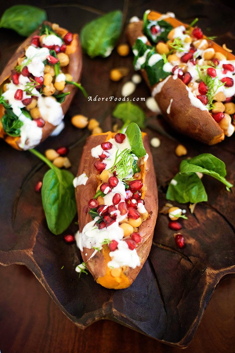 Stuffed sweet potatoes with chickpeas, spinach and pomegranate