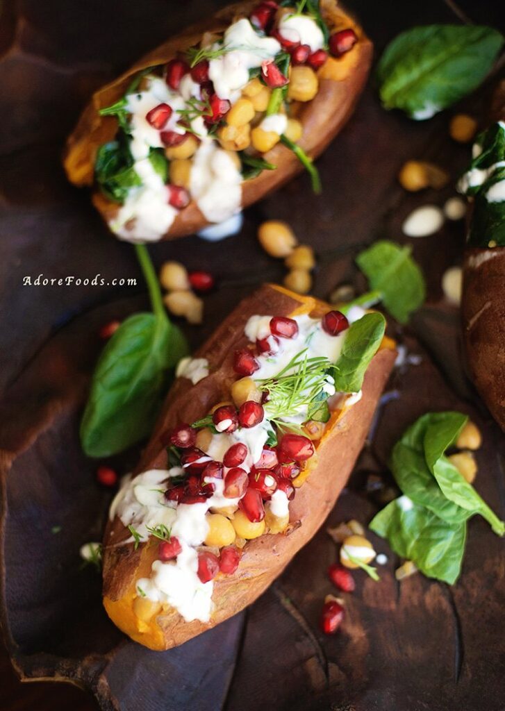 Stuffed sweet potatoes with chickpeas, spinach and pomegranate