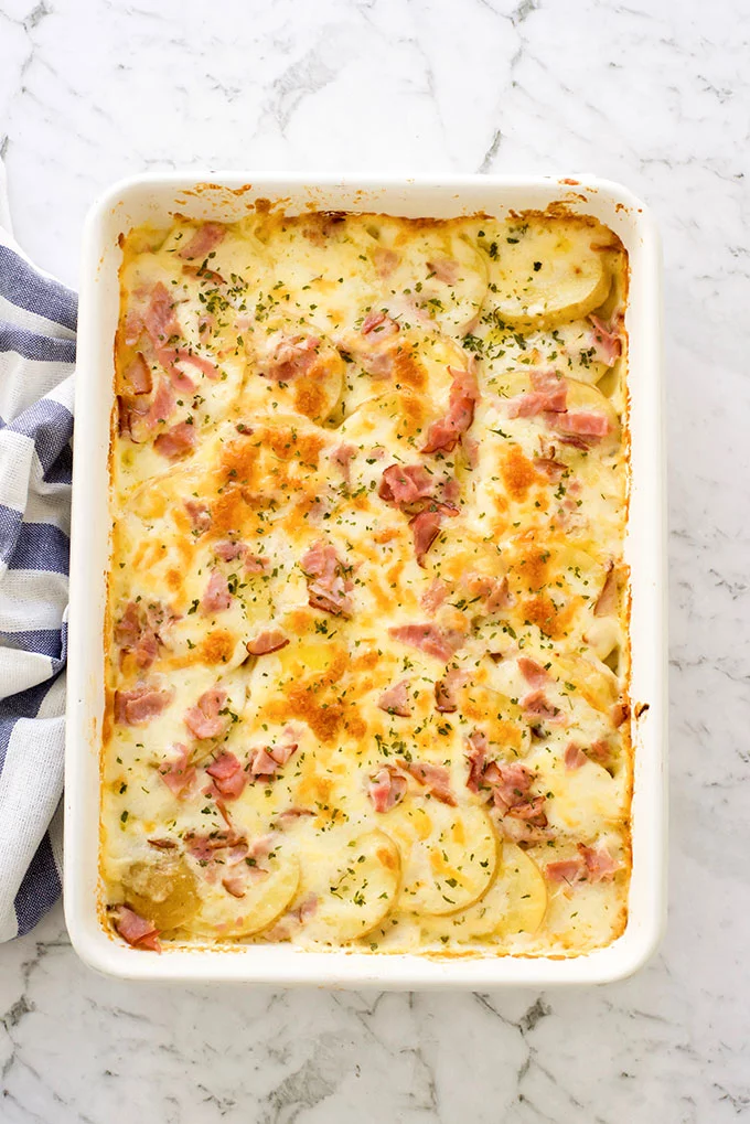 Creamy scalloped potatoes and ham out of the oven, ready to be served