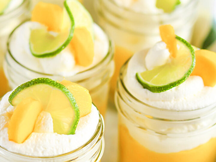 mason jars filled with no bake mango and lime pie