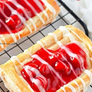 Indulge in the perfect blend of sweet cherries and creamy cheese with this Cherry Cream Cheese Danish recipe. Flaky, buttery pastry layers are filled with luscious cream cheese and topped with vibrant cherry preserves&mdash;ideal for breakfast, brunch, or a delightful dessert.