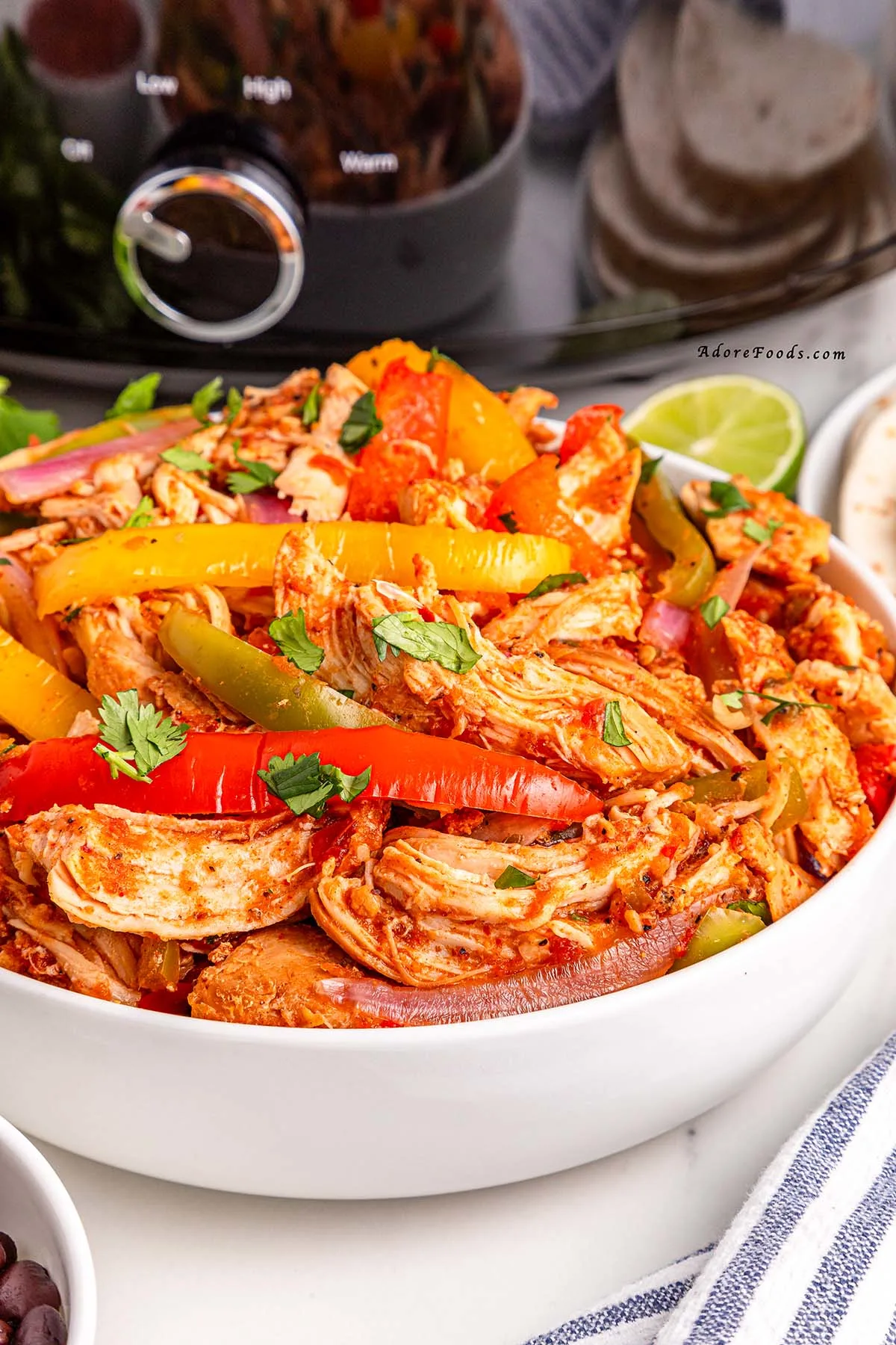 Easy Crockpot Chicken Fajitas made with juicy chicken, colorful bell peppers, and zesty fajita seasoning&mdash;perfect for a flavorful and effortless weeknight dinner! Just 10 minutes of prep and the slow cooker does the rest. Serve in tortillas, bowls, or over rice. Great for meal prep, family dinners, and Tex-Mex nights!