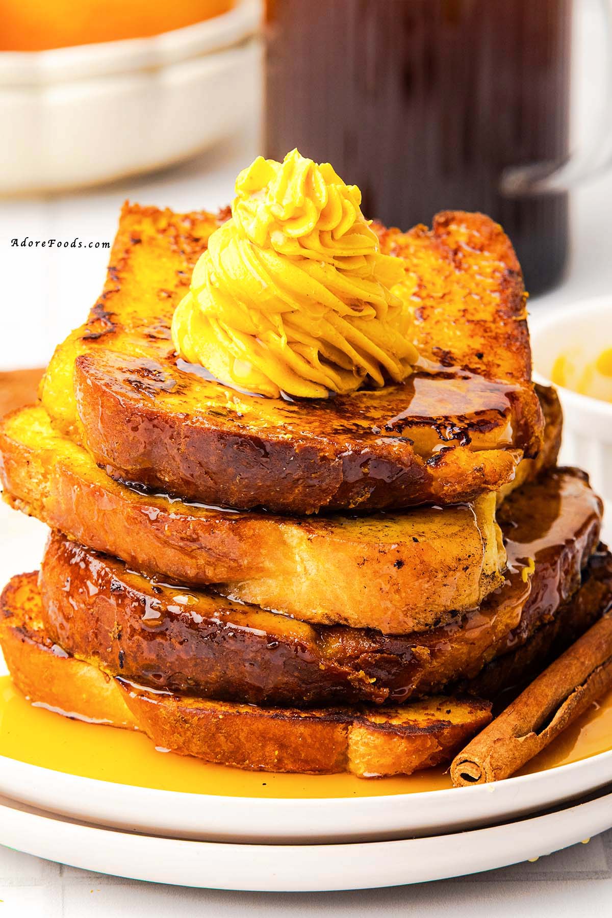 Warm, cozy, and full of fall flavor, this Pumpkin French Toast is made with thick brioche slices dipped in a creamy pumpkin custard, sprinkled with pumpkin pie spice, and cooked to golden perfection. Topped with whipped pumpkin butter and drizzled with maple syrup, it’s the perfect autumn breakfast or holiday brunch recipe your taste buds will love!