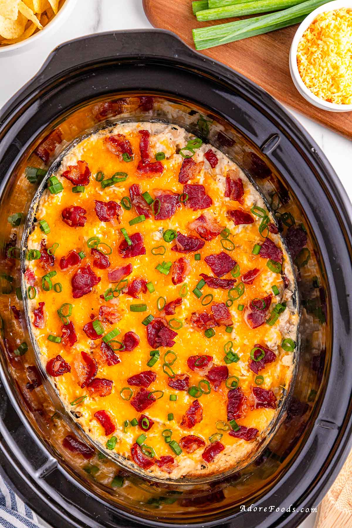 Creamy Crock Pot Crack Chicken made with shredded chicken, ranch seasoning, cream cheese, cheddar, and crispy bacon. Easy slow cooker chicken recipe perfect for family dinners, game day, or cheesy sandwich filling. Comfort food made simple in the Crock Pot.