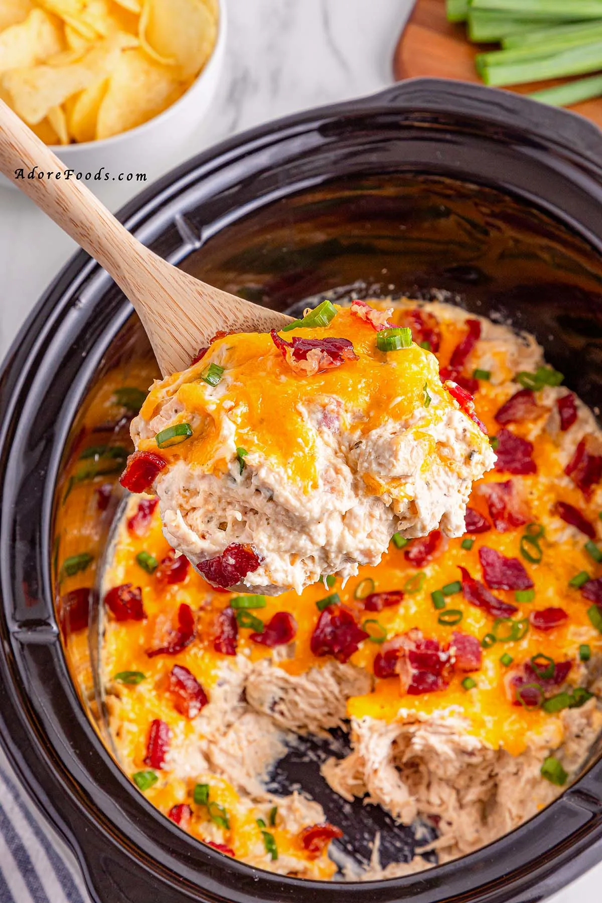 Creamy Crock Pot Crack Chicken made with shredded chicken, ranch seasoning, cream cheese, cheddar, and crispy bacon. Easy slow cooker chicken recipe perfect for family dinners, game day, or cheesy sandwich filling. Comfort food made simple in the Crock Pot.
