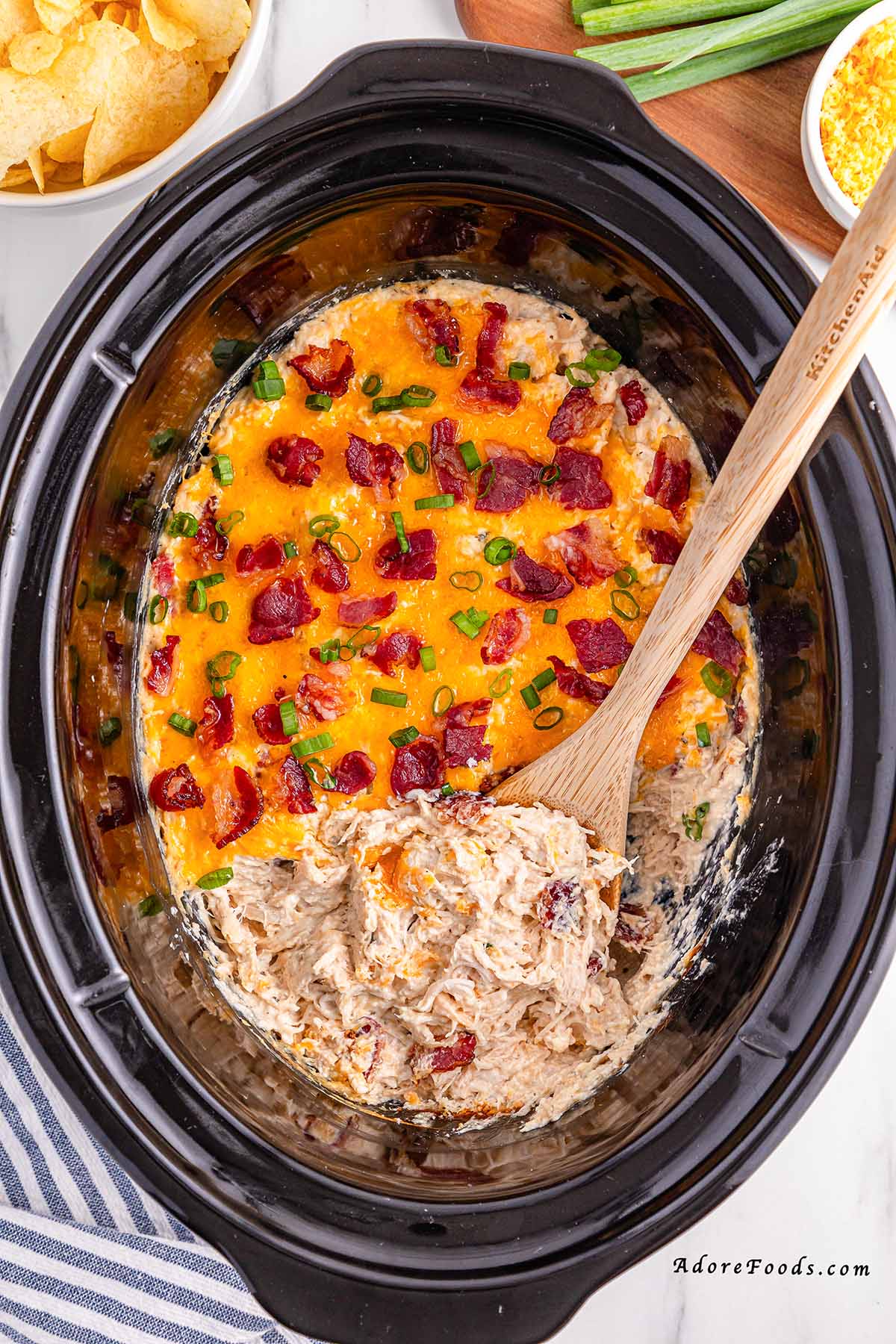 Creamy Crock Pot Crack Chicken made with shredded chicken, ranch seasoning, cream cheese, cheddar, and crispy bacon. Easy slow cooker chicken recipe perfect for family dinners, game day, or cheesy sandwich filling. Comfort food made simple in the Crock Pot.