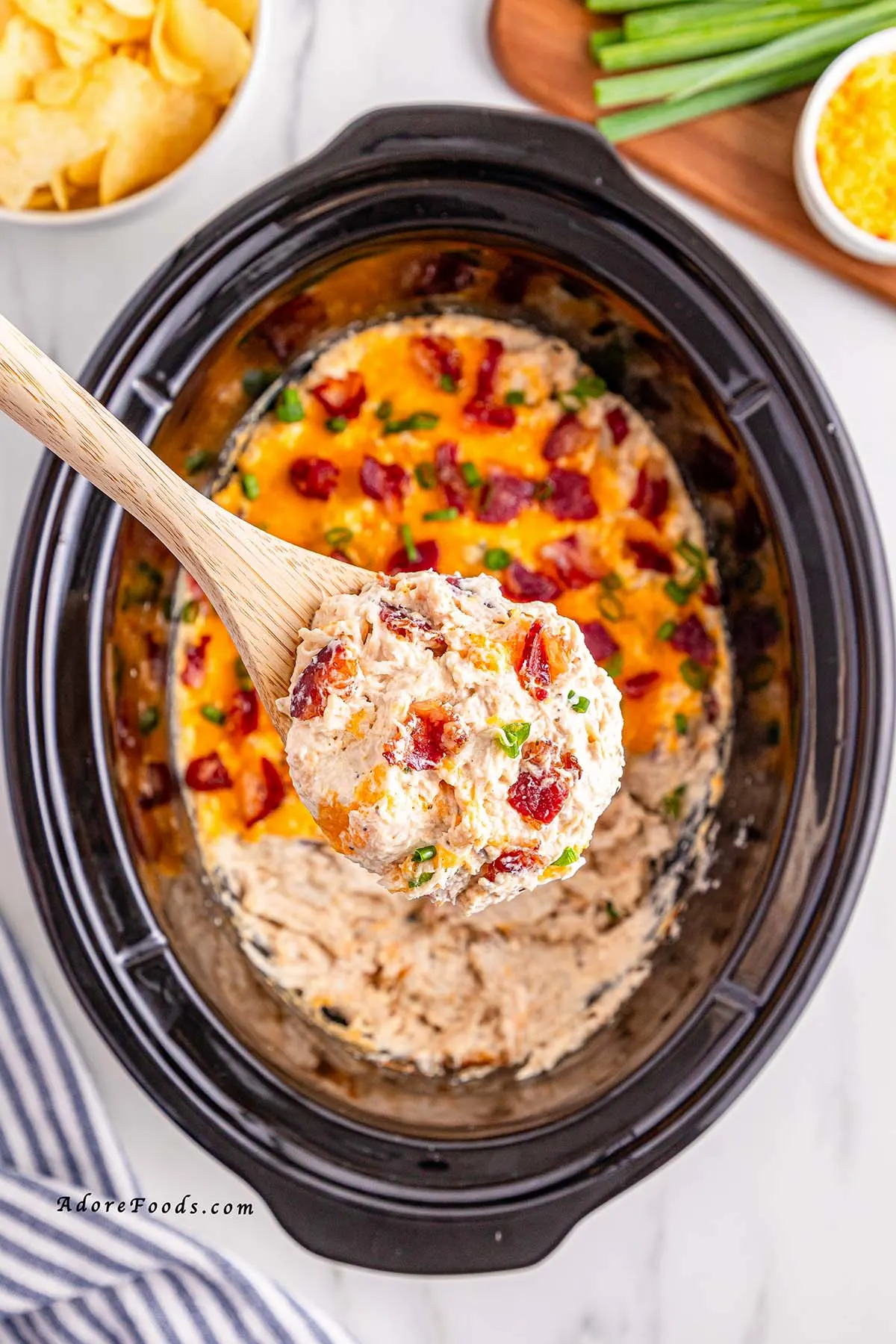 Creamy Crock Pot Crack Chicken made with shredded chicken, ranch seasoning, cream cheese, cheddar, and crispy bacon. Easy slow cooker chicken recipe perfect for family dinners, game day, or cheesy sandwich filling. Comfort food made simple in the Crock Pot.