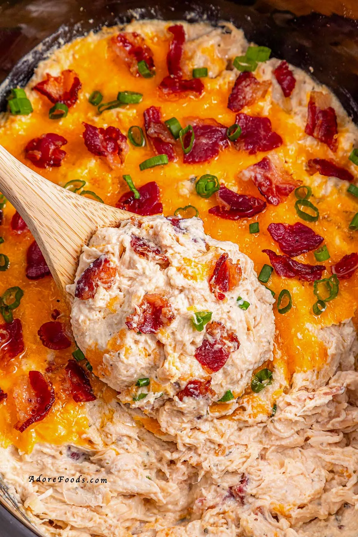 Creamy Crock Pot Crack Chicken made with shredded chicken, ranch seasoning, cream cheese, cheddar, and crispy bacon. Easy slow cooker chicken recipe perfect for family dinners, game day, or cheesy sandwich filling. Comfort food made simple in the Crock Pot.