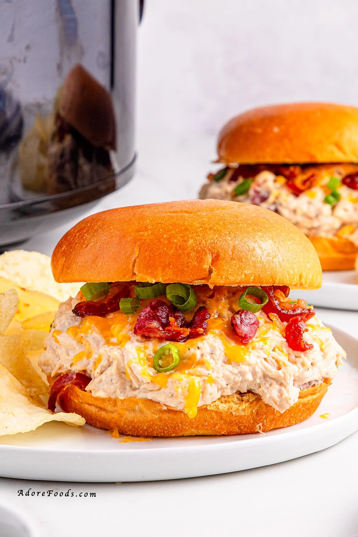 Creamy Crock Pot Crack Chicken made with shredded chicken, ranch seasoning, cream cheese, cheddar, and crispy bacon. Easy slow cooker chicken recipe perfect for family dinners, game day, or cheesy sandwich filling. Comfort food made simple in the Crock Pot.